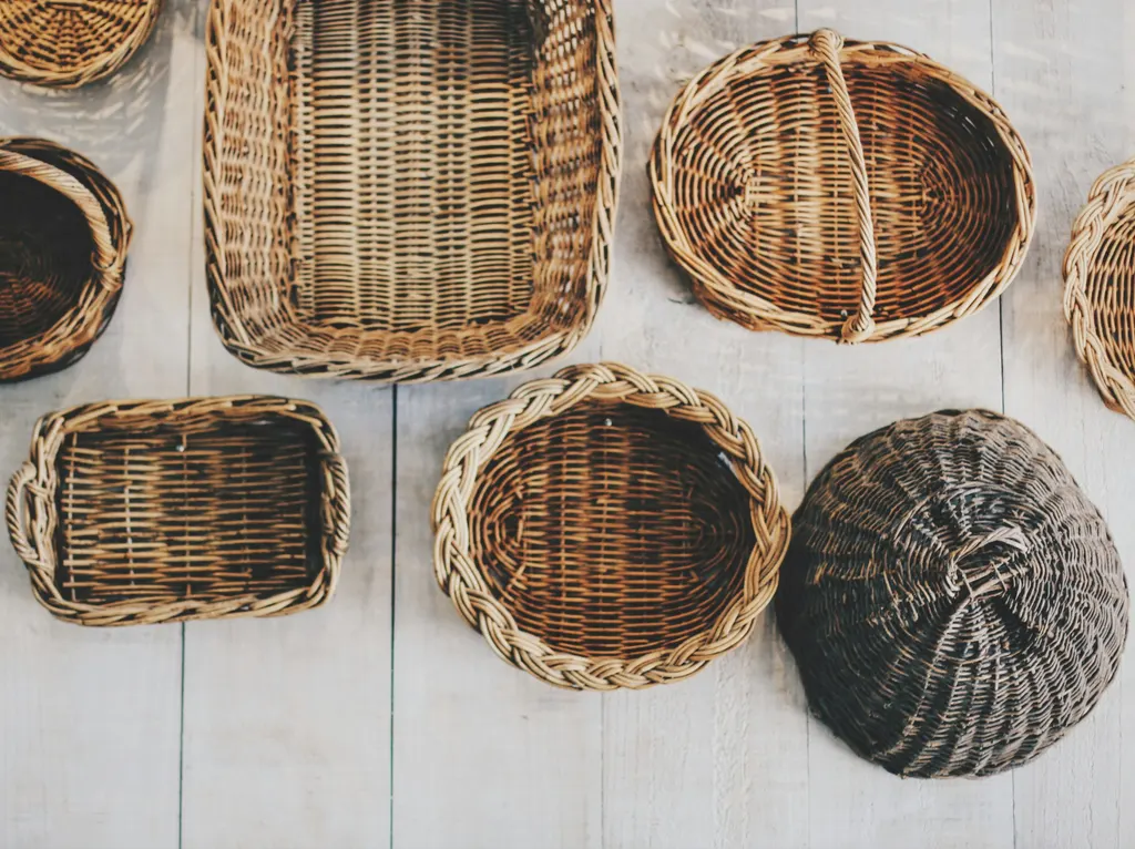 Storage baskets and organisation products on shelving.