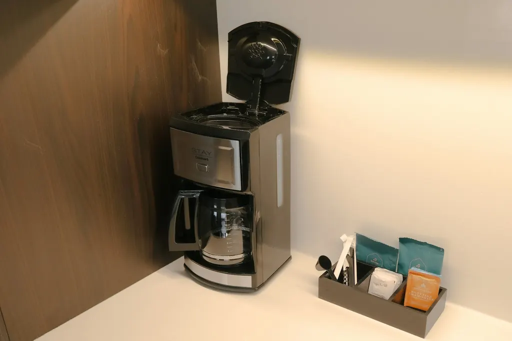 Prepared guest room with fresh linens and amenities, representing property-use supplies.